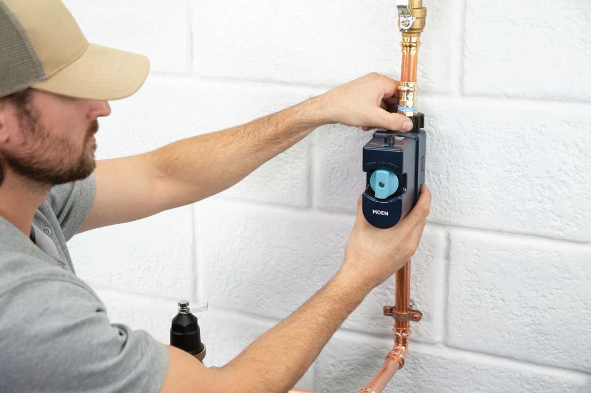 Plumber installing Flo Smart Water Monitor & Shutoff