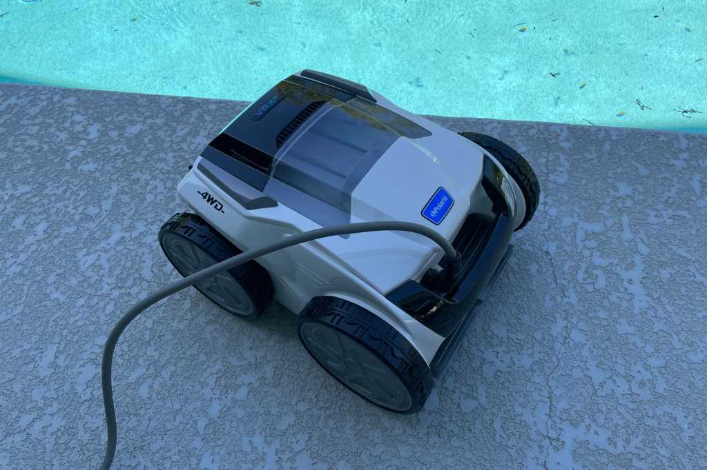 Polaris VRX iQ+ pool-cleaning robot next at poolside