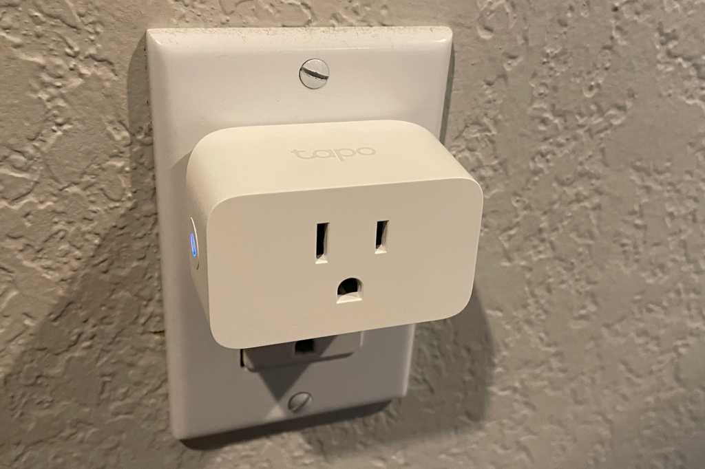 Tapo P125M Matter-compatible smart plug in outlet angle view